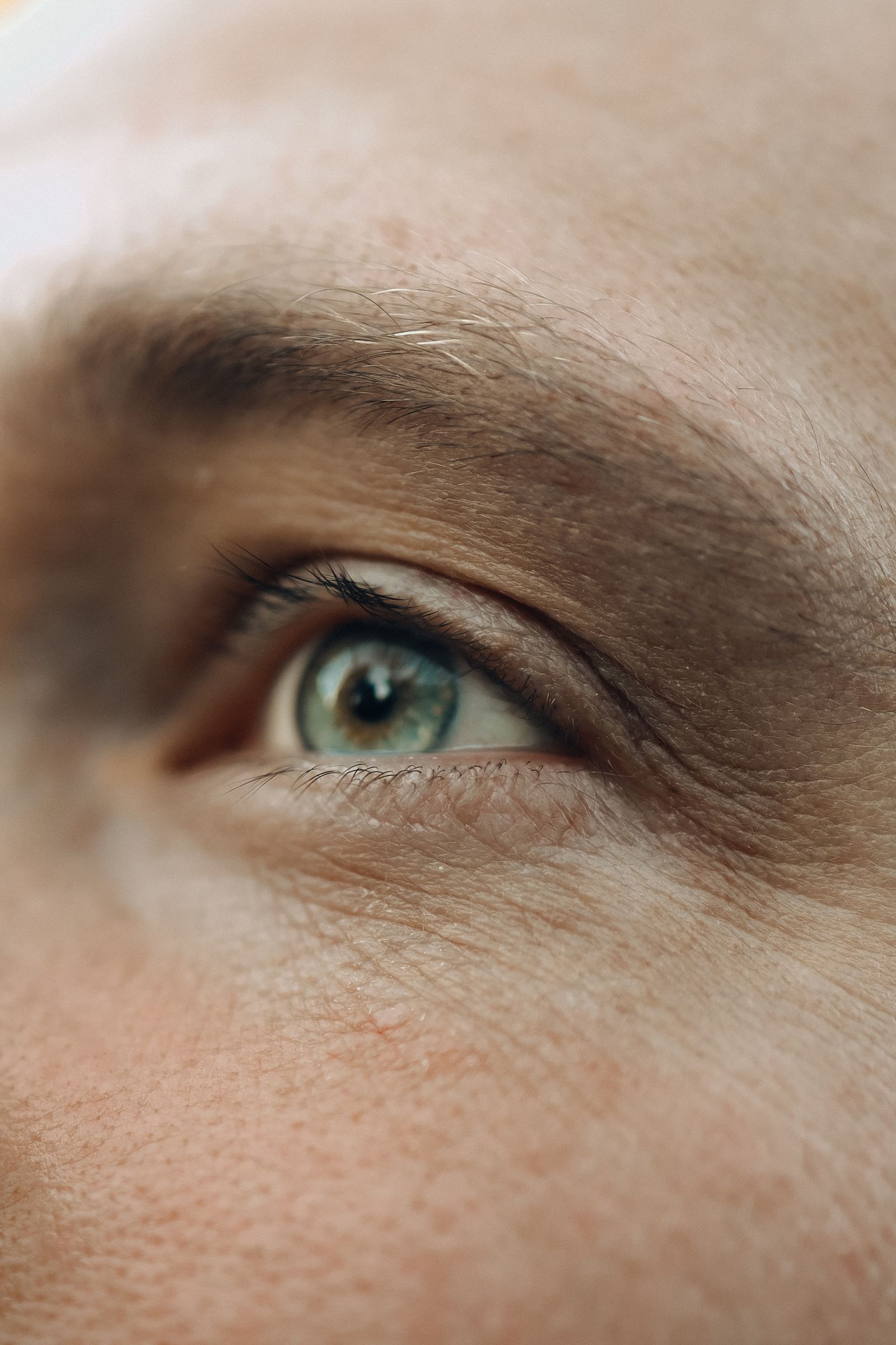 Close-up of a human eye, representing a contact lens fitting